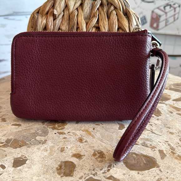 Coach double zipper wallet in burgundy pebbled leather. Measures 6 1/2” x 4”. - Picture 2 of 5